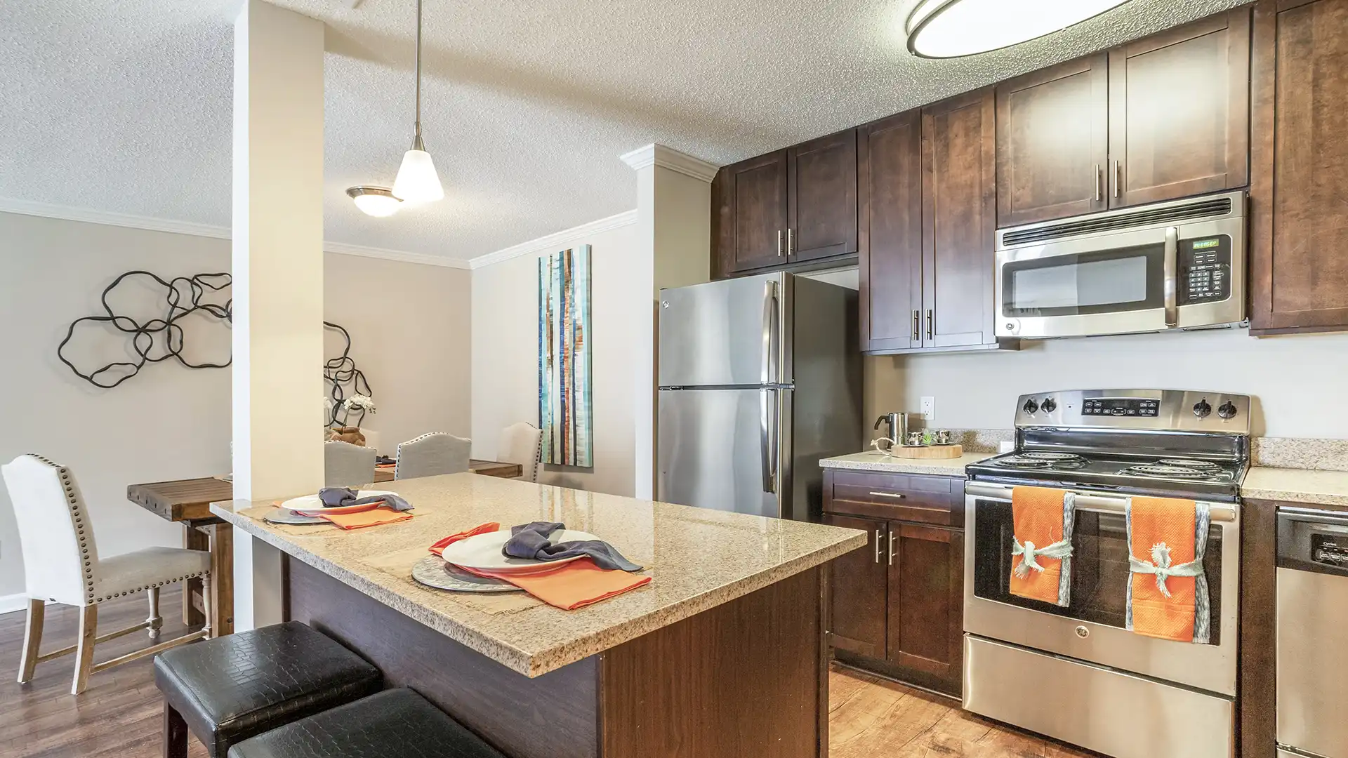 model kitchen with modern stainless steel appliances and Modern 42" Shaker Cabinets with Brushed Nickel Accents