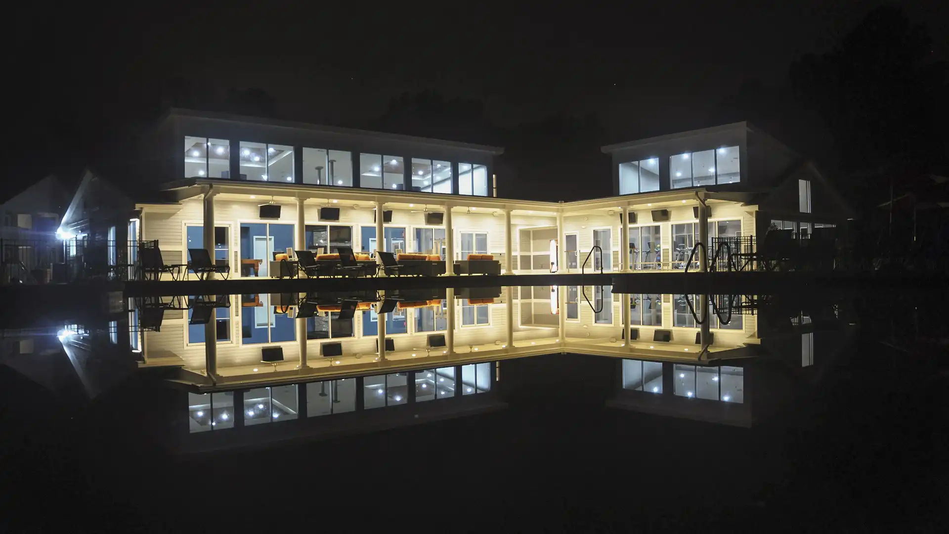 night view of leasing and community building exterior