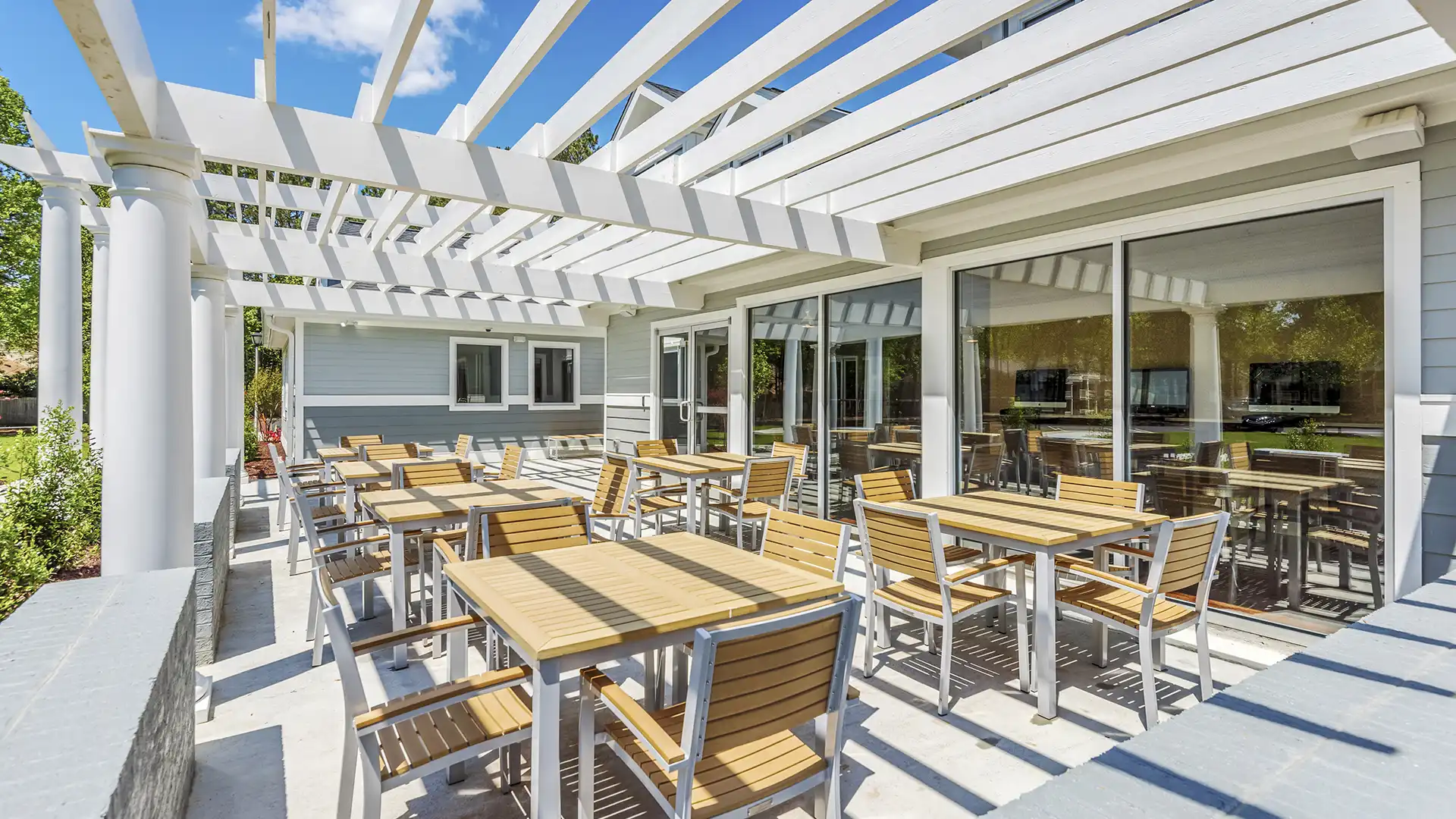 business center and pergola covered patio with plenty of seating inside and out.