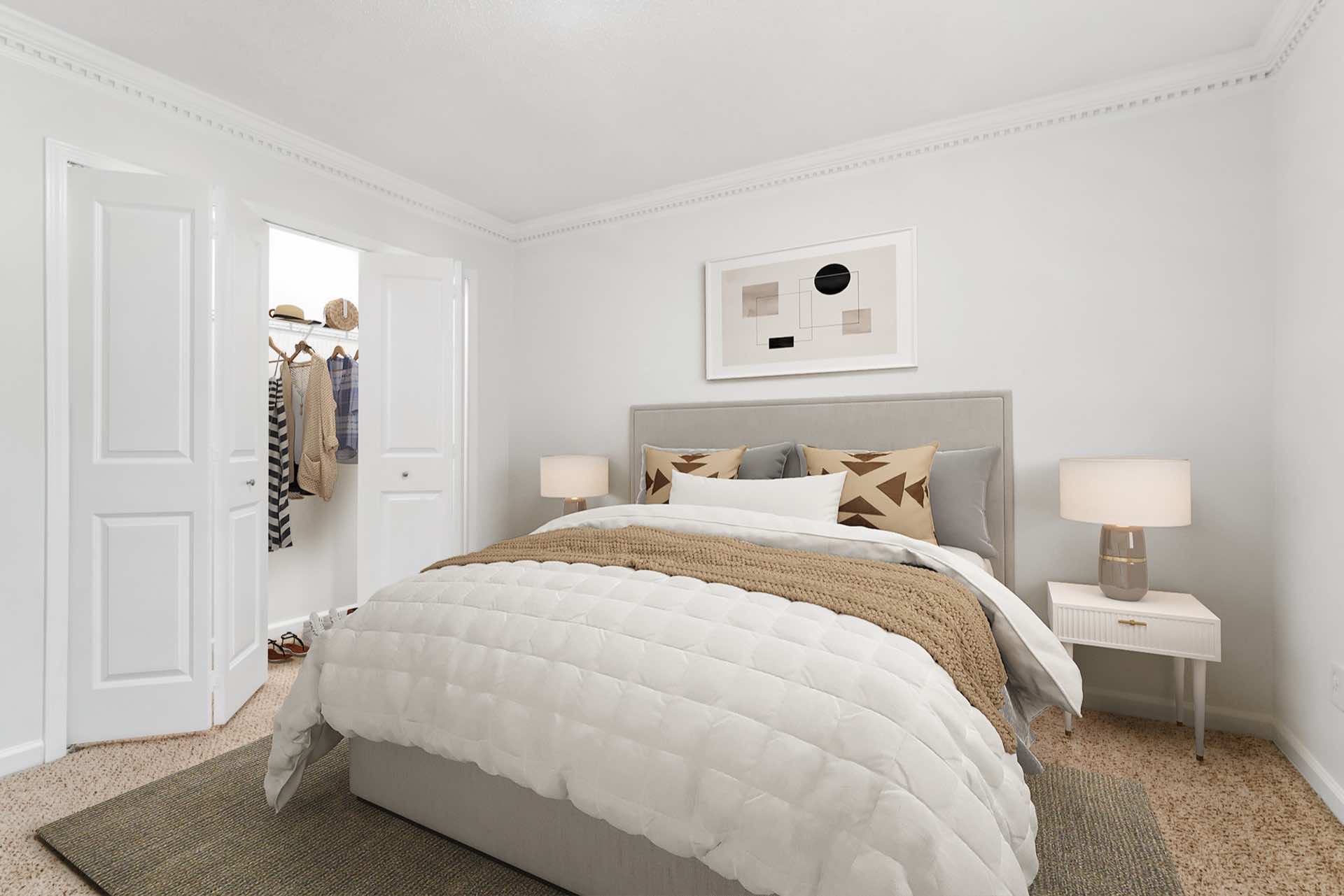 bedroom with plush carpeting, wall art, and reach-in closet