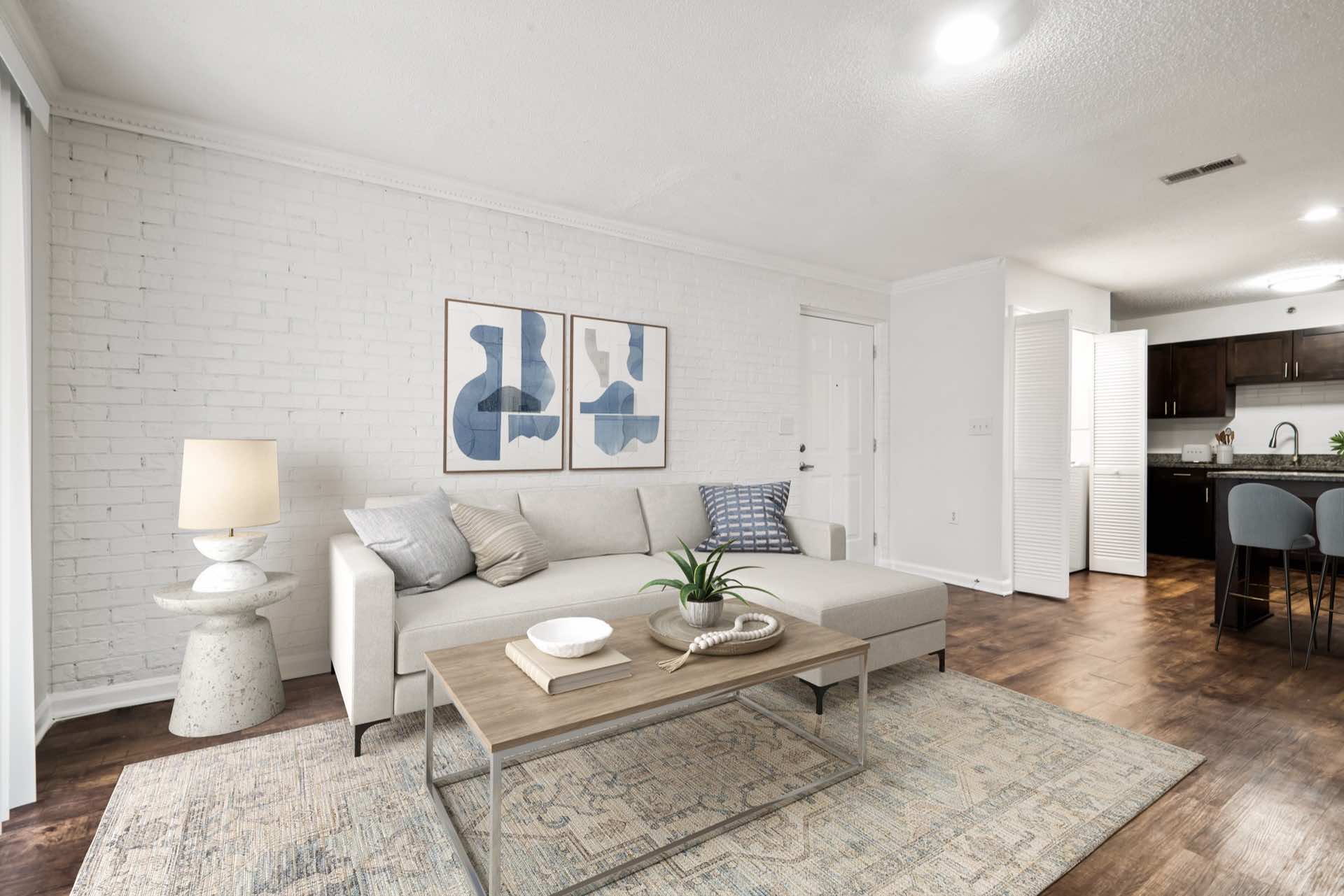 living room with modern furniture and large stylish rug on wood-style floor