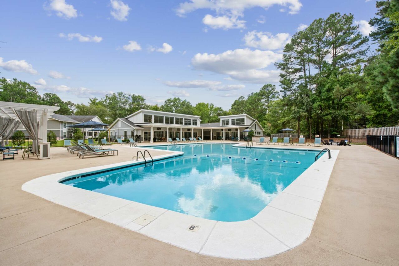 pool with large deck area and cabanas