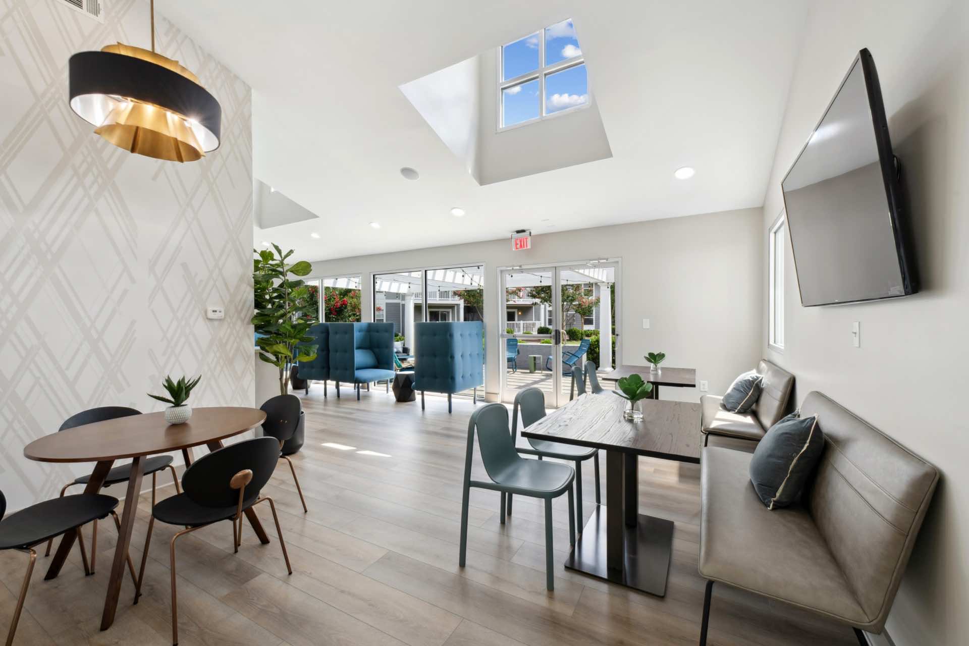 high ceilings and natural lighting in community room